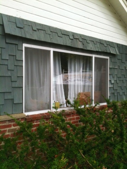 This is a perfect example of the drafty, ugly aluminum windows -- this one is going to be gone SOON as well.