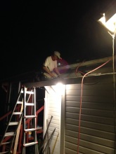 roofing in the dark to beat tomorrow's rain
